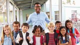  Staff Member with students